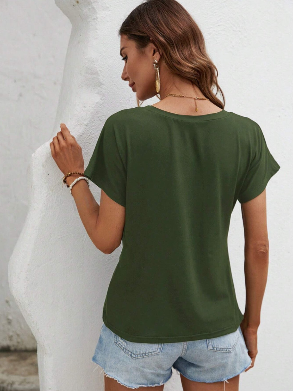 T-shirt col rond à ourlet asymétrique