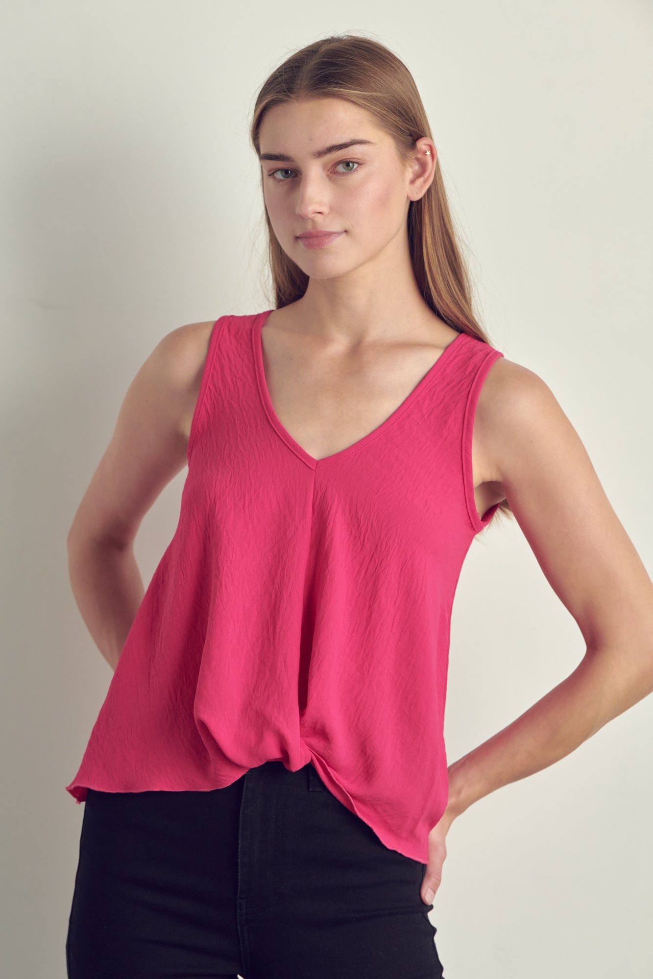 V-neck sleeveless knotted front hi-low top