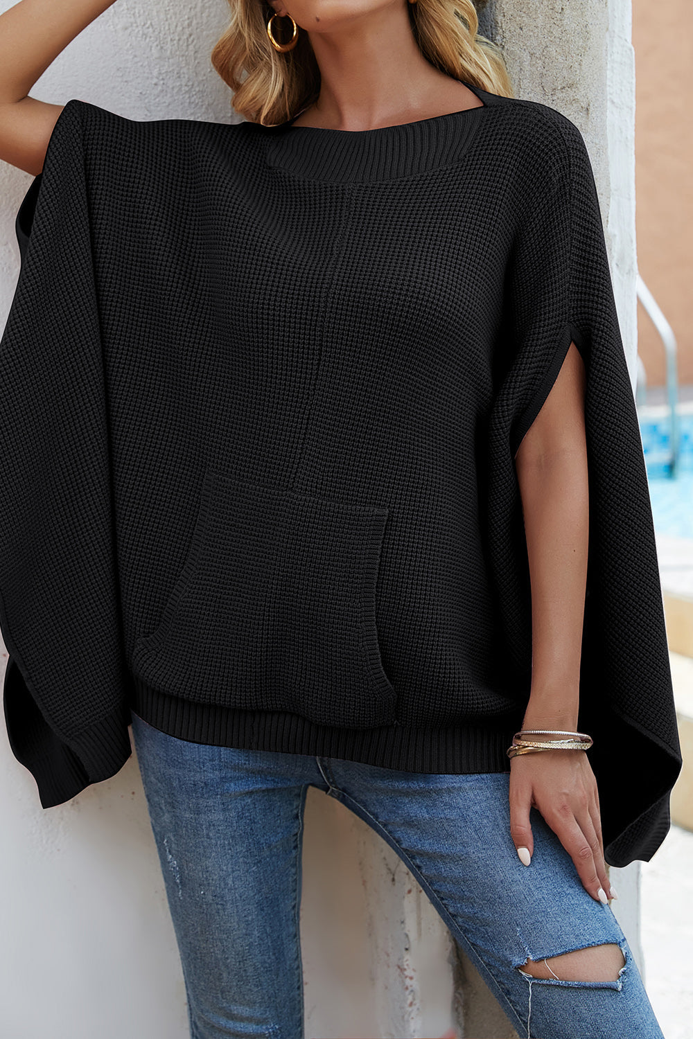 Pull à manches cape et poches en tricot gaufré