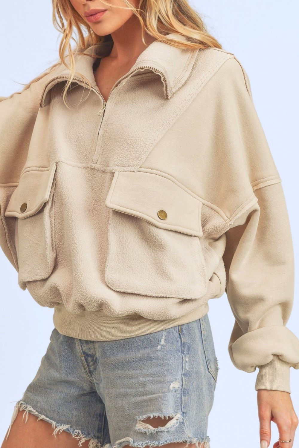 Sweat-shirt demi-zippé à coutures apparentes et poches Aemi + Co