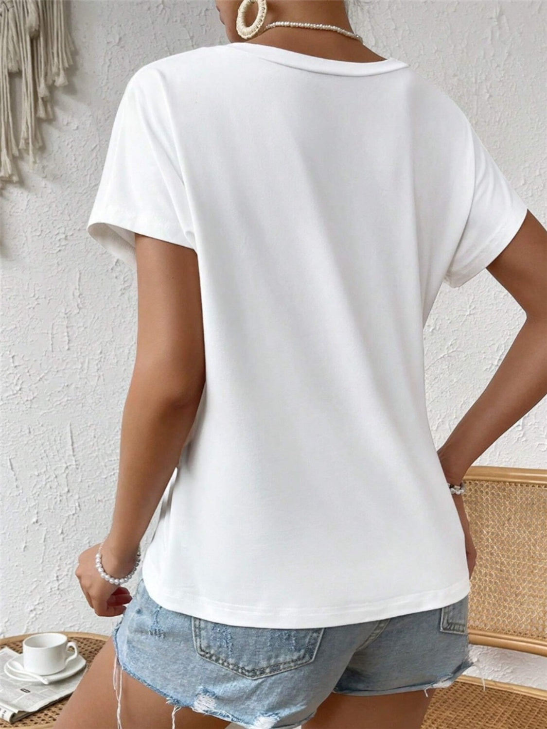 T-shirt col rond à ourlet asymétrique