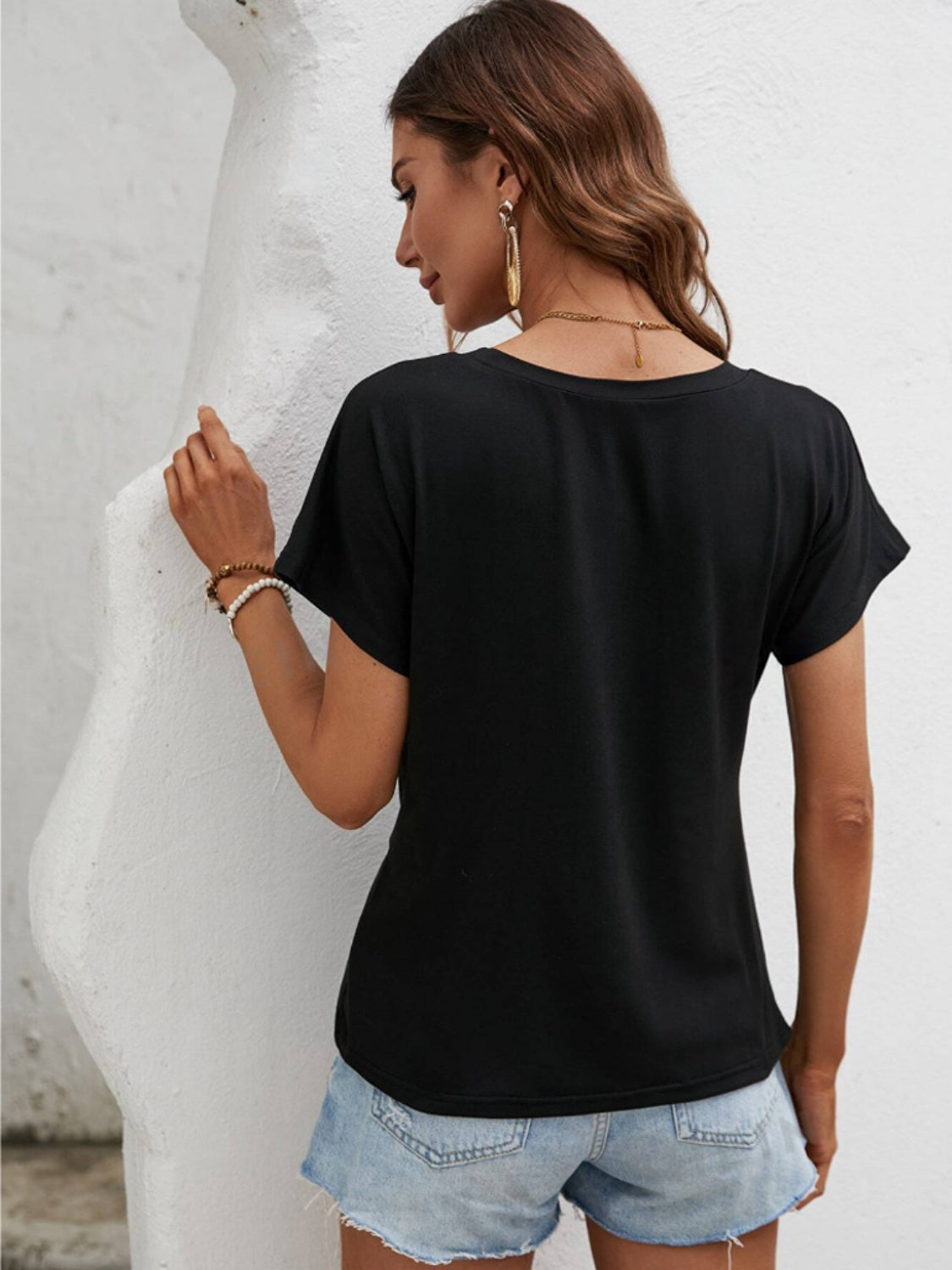 T-shirt col rond à ourlet asymétrique