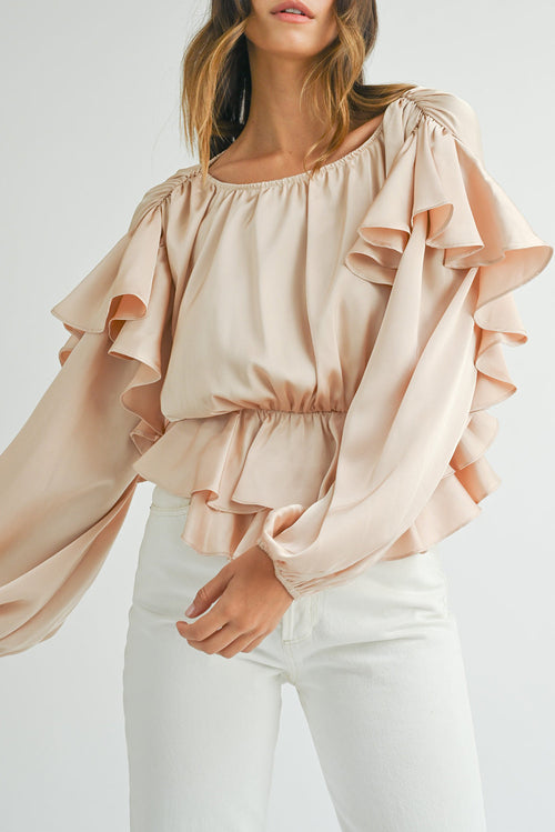Blusa peplum con volantes, espalda con abertura y cordones en color avena