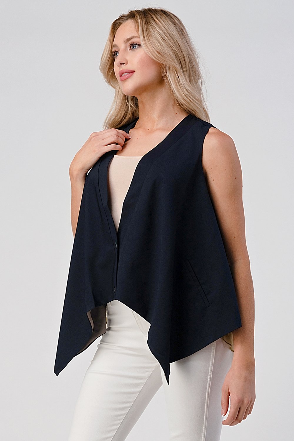 Gilet asymétrique boutonné sans manches avec ourlet superposé
