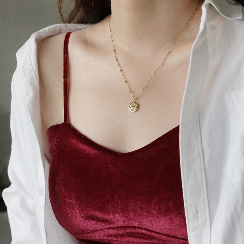 Collar de monedas de mal de ojo azul