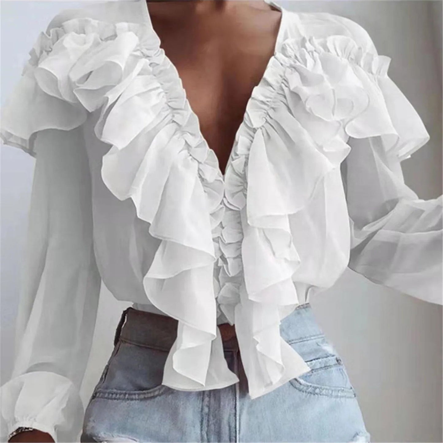 Blusa elegante de gasa con volantes