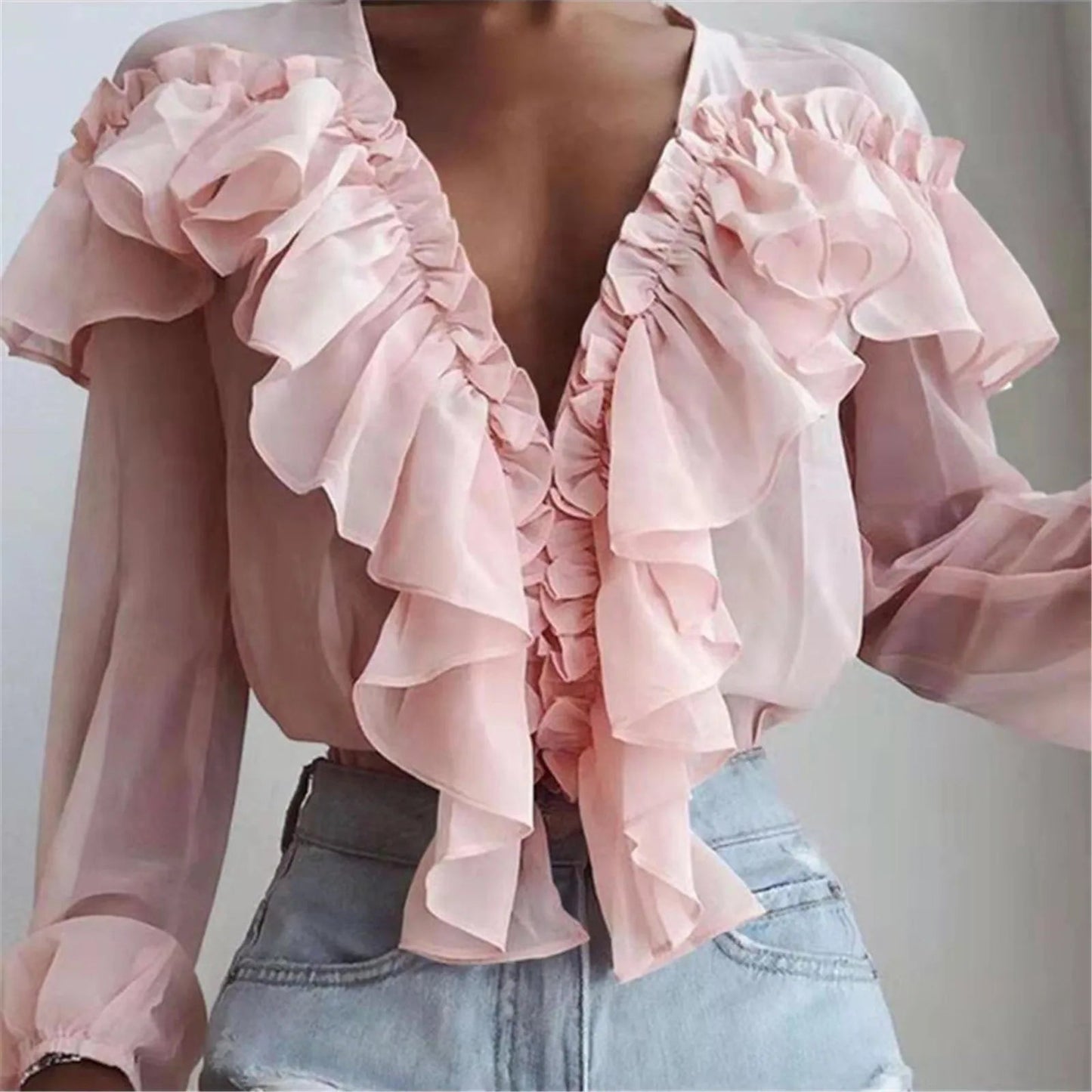 Blusa elegante de gasa con volantes