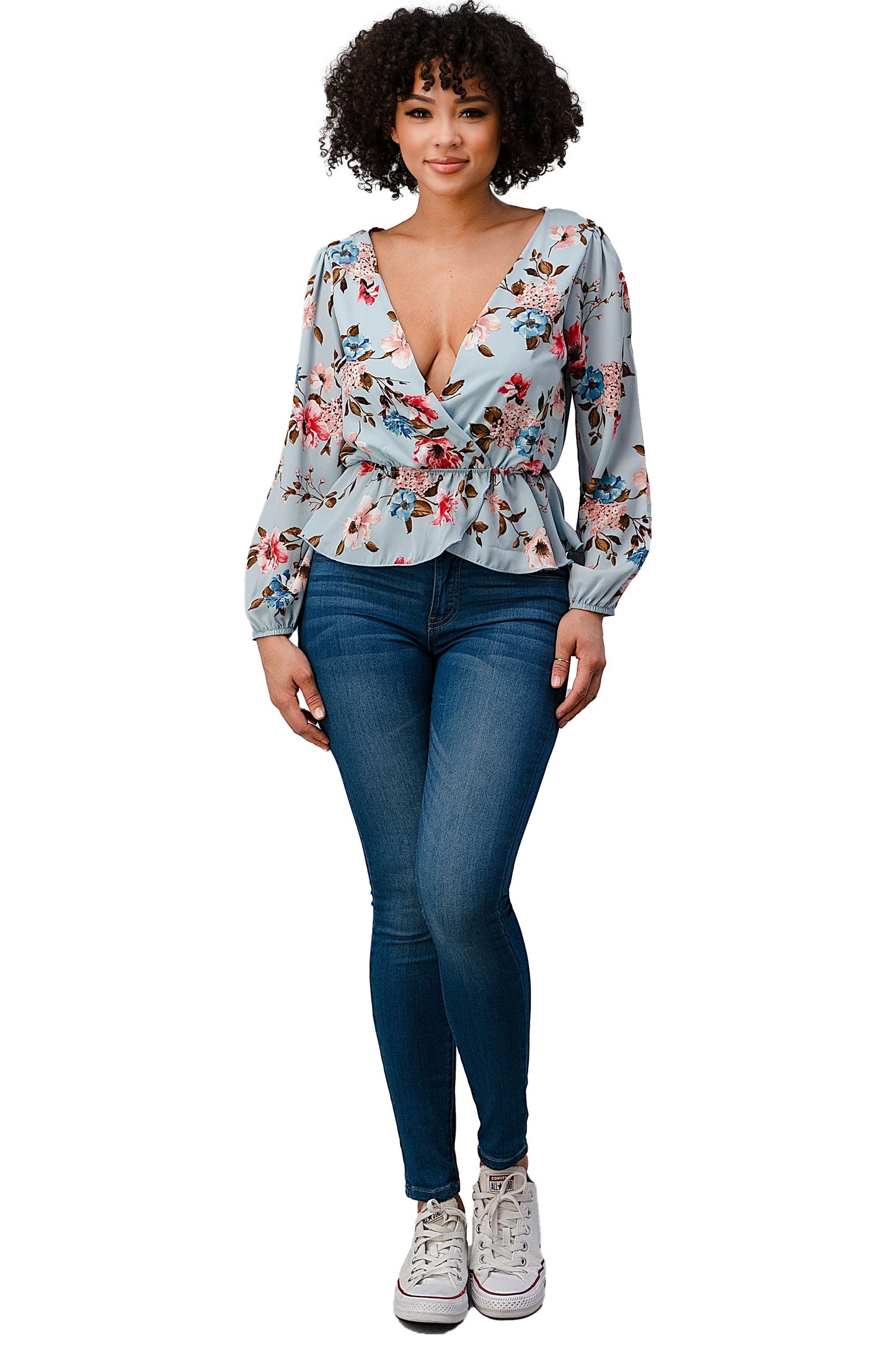 Blusa con dobladillo peplum y sobrepelliz estampada