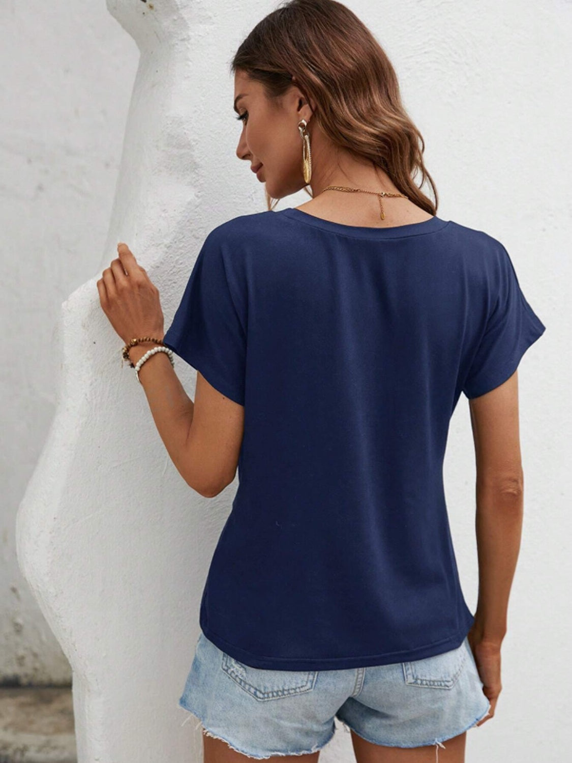 T-shirt col rond à ourlet asymétrique