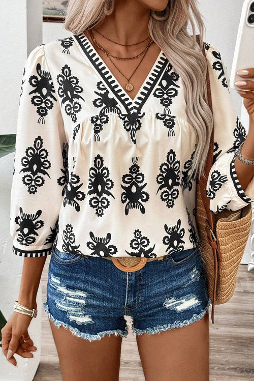 Blusa beige vintage con estampado geométrico, mangas 3/4 y cuello en V