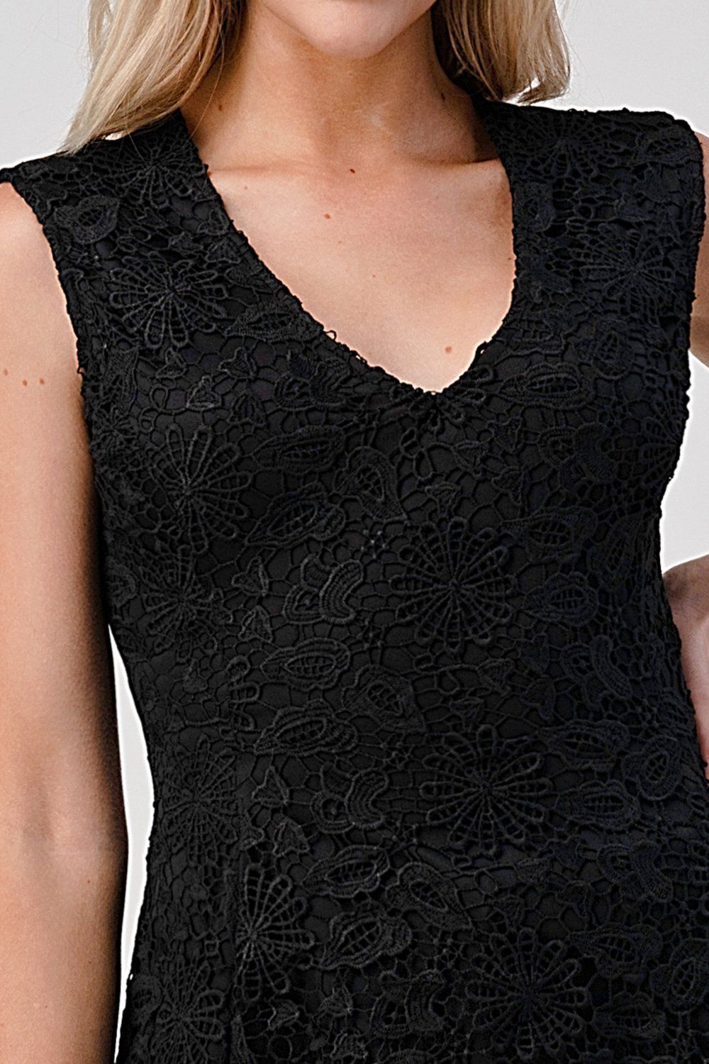 Haut péplum en dentelle sans manches à col en V