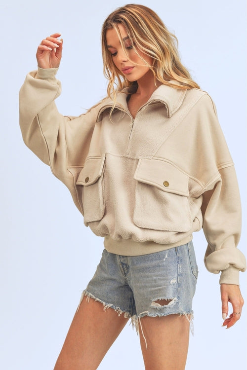 Sweat-shirt demi-zippé à coutures apparentes et poches Aemi + Co