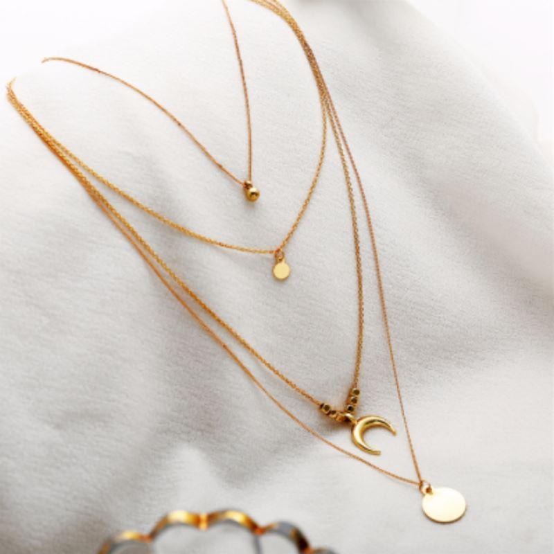 Collier doré à quatre rangs