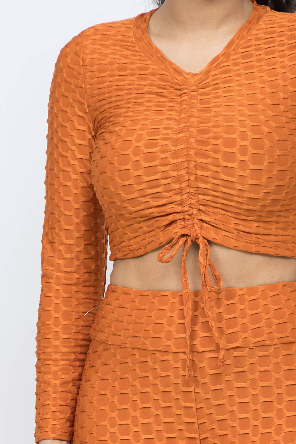 Conjunto de top y leggings con lazo fruncido en nido de abeja