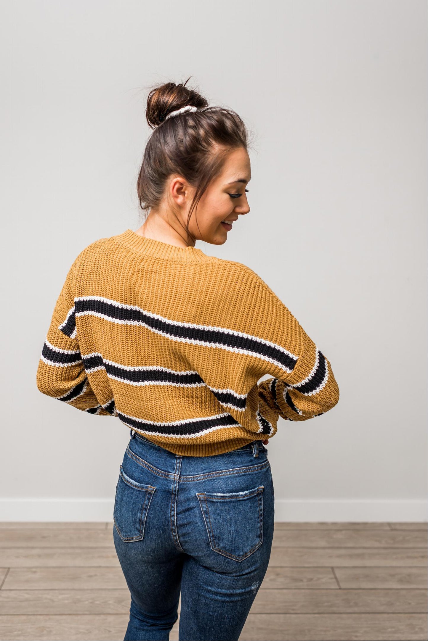 Pull en maille à rayures et manches chauve-souris