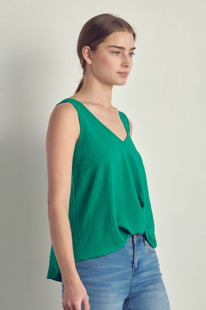 V-neck sleeveless knotted front hi-low top