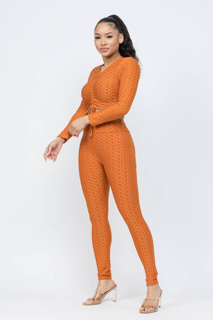 Conjunto de top y leggings con lazo fruncido en nido de abeja