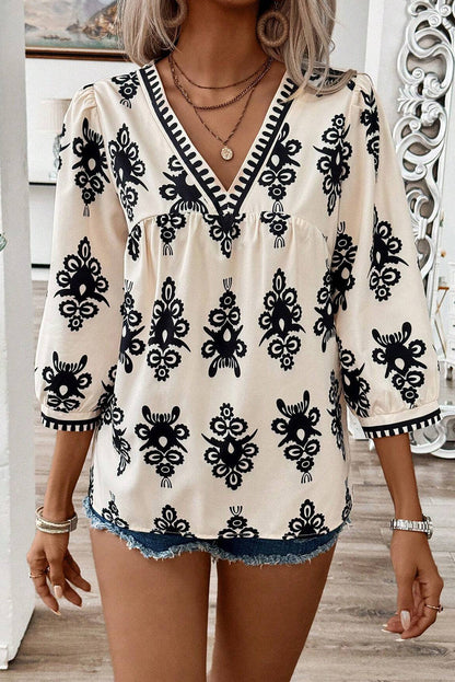 Blusa beige vintage con estampado geométrico, mangas 3/4 y cuello en V