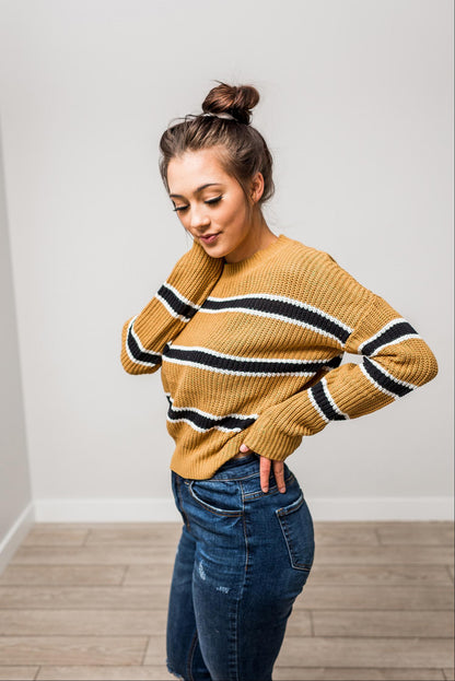 Pull en maille à rayures et manches chauve-souris