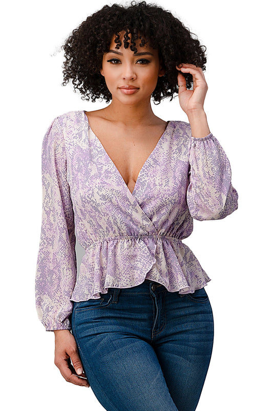 Blusa con dobladillo peplum y sobrepelliz estampada