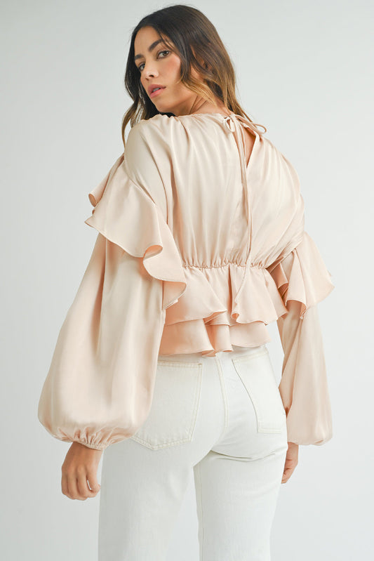 Blusa peplum con volantes, espalda con abertura y cordones en color avena
