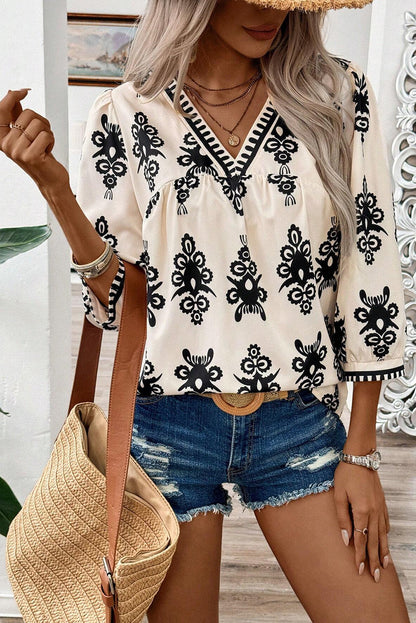 Blusa beige vintage con estampado geométrico, mangas 3/4 y cuello en V