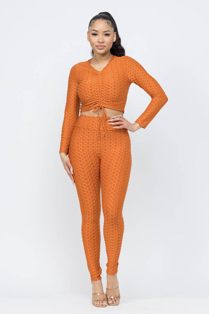 Conjunto de top y leggings con lazo fruncido en nido de abeja