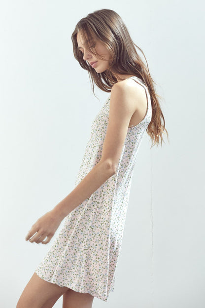 Robe courte trapèze sans manches en maille fleurie marguerite