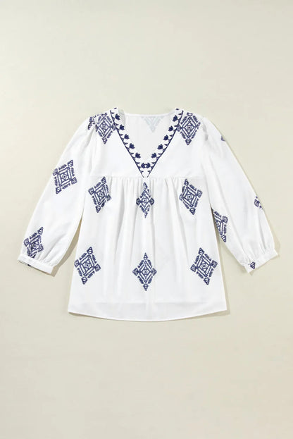 Blusa estampada con cuello en V y mangas tres cuartos