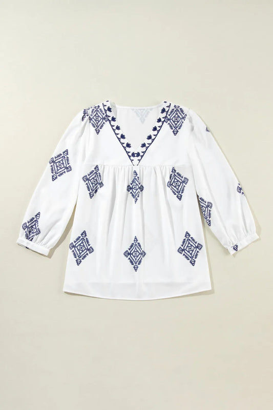 Blusa estampada con cuello en V y mangas tres cuartos