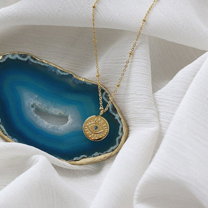 Collar de monedas de mal de ojo azul