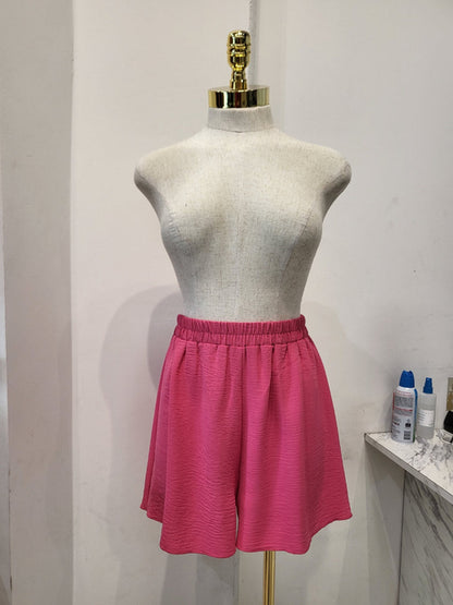 Shorts rosas texturizados de cintura alta con cinturilla elástica