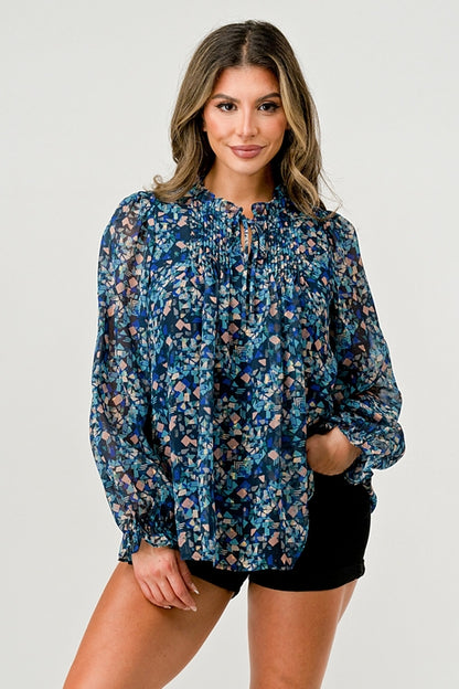 Blusa de manga larga con estampado transparente y detalle fruncido