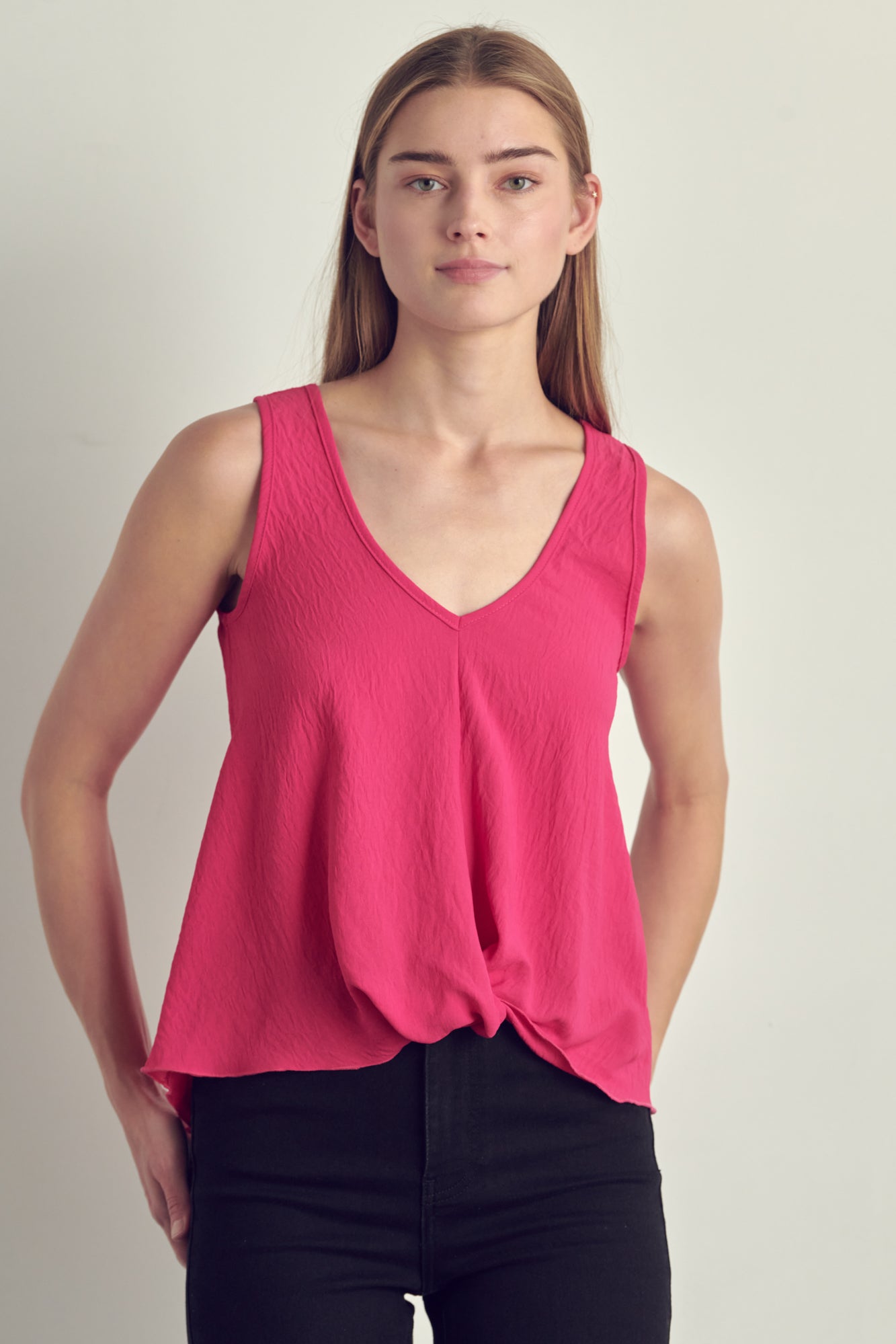 V-neck sleeveless knotted front hi-low top