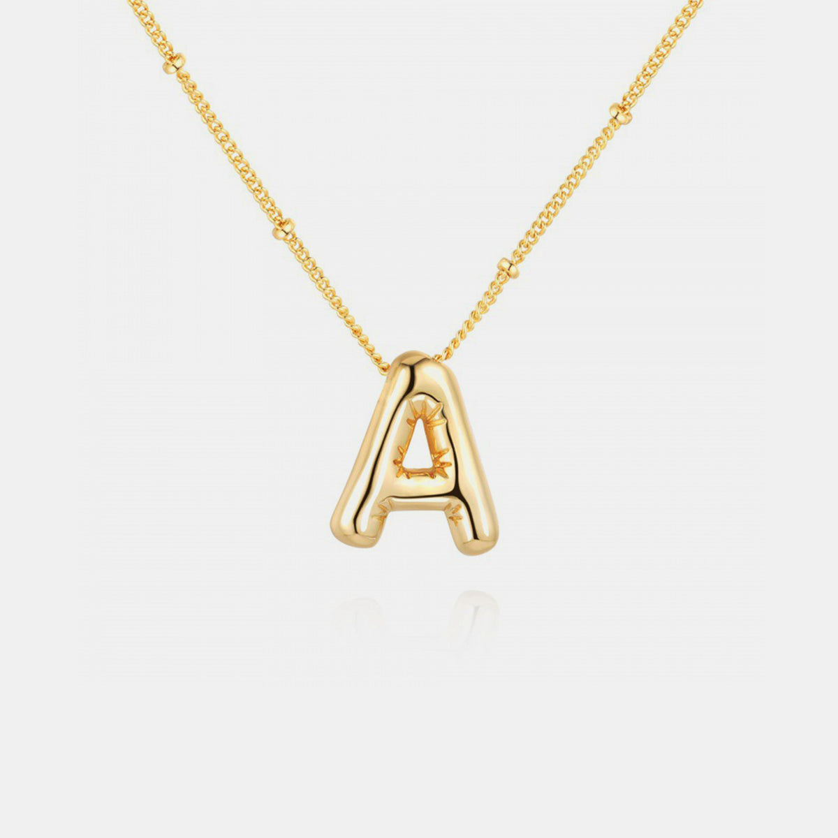 Collier pendentif lettre plaqué or