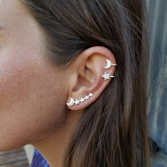 Conjunto de pendientes y brazaletes de luna y estrella