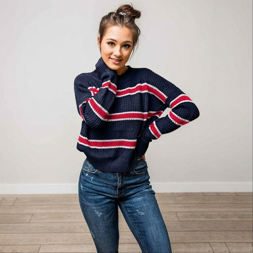 Pull en maille à rayures et manches chauve-souris
