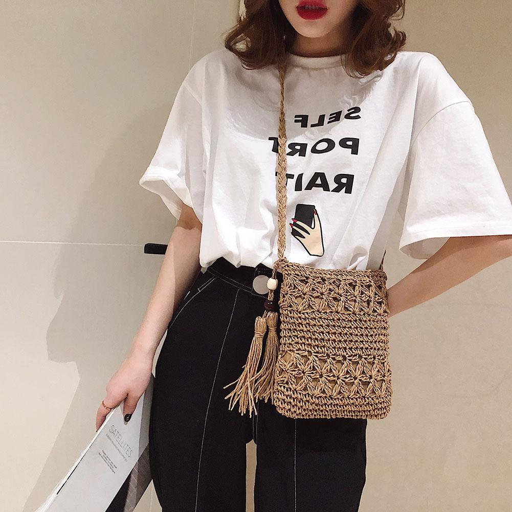 Petit sac bandoulière d'été en paille avec pompon